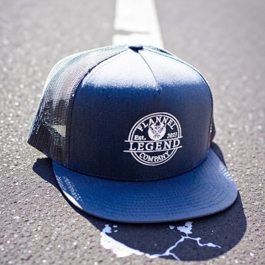 LEGEND NAVY BLUE WITH WHITE LOGO SNAP BACK FLAT BILL TRUCKER HAT