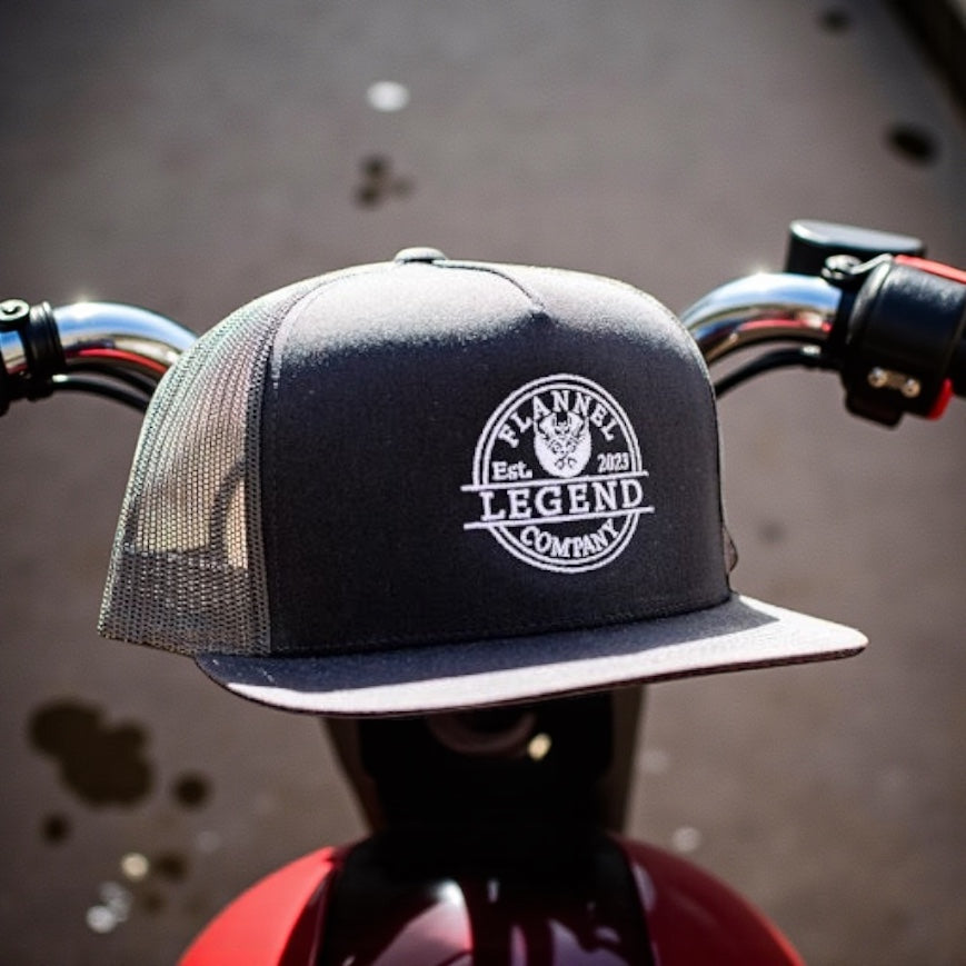 LEGEND BLACK WITH WHITE LOGO FLAT BILL SNAP BACK TRUCKER HAT