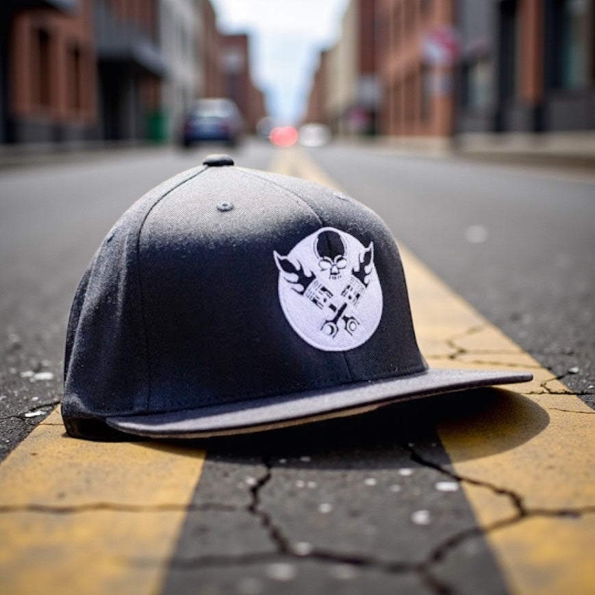 LEGEND BLACK WITH WHITE PISTON LOGO FLAT BILL FLEX FIT TRUCKER HAT