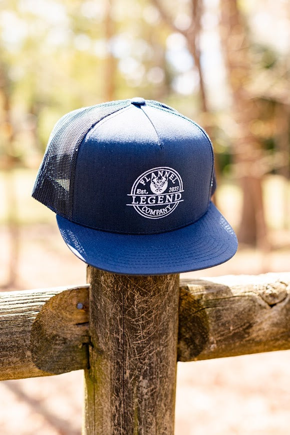 LEGEND NAVY BLUE WITH WHITE LOGO SNAP BACK FLAT BILL TRUCKER HAT